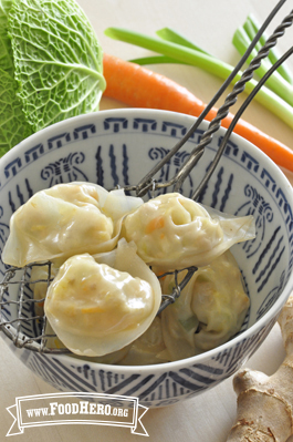 Bowl of wontons with a chicken and vegetable filling.