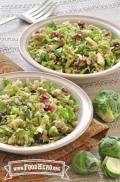 Dishes of salad featuring Brussels sprouts, dried cranberries and nuts mixed with a citrus dressing.