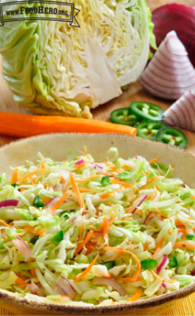 Shallow bowl of pickled cabbage and sliced vegetables.