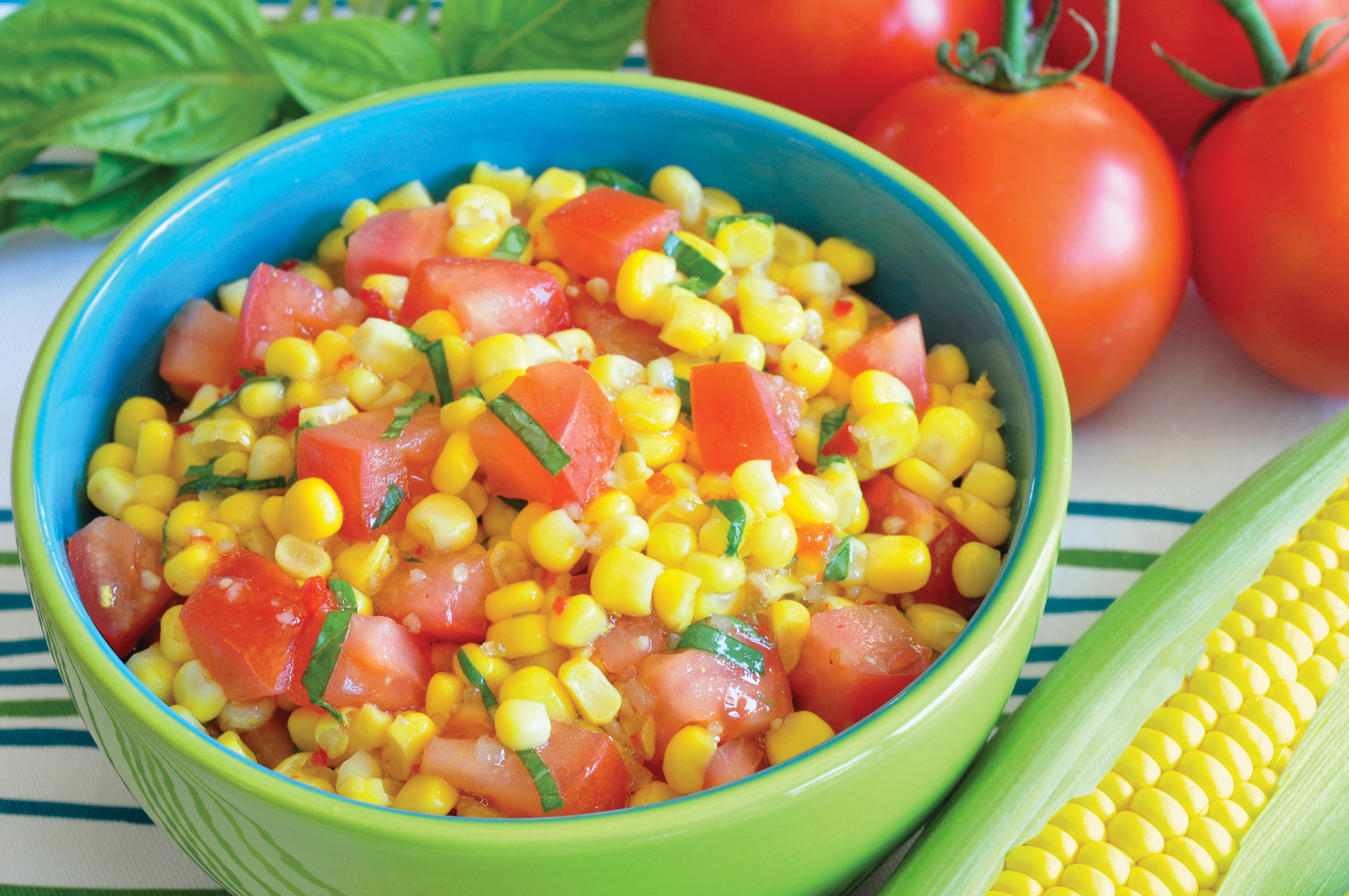 Corn and Tomato Salad in bright green bowl