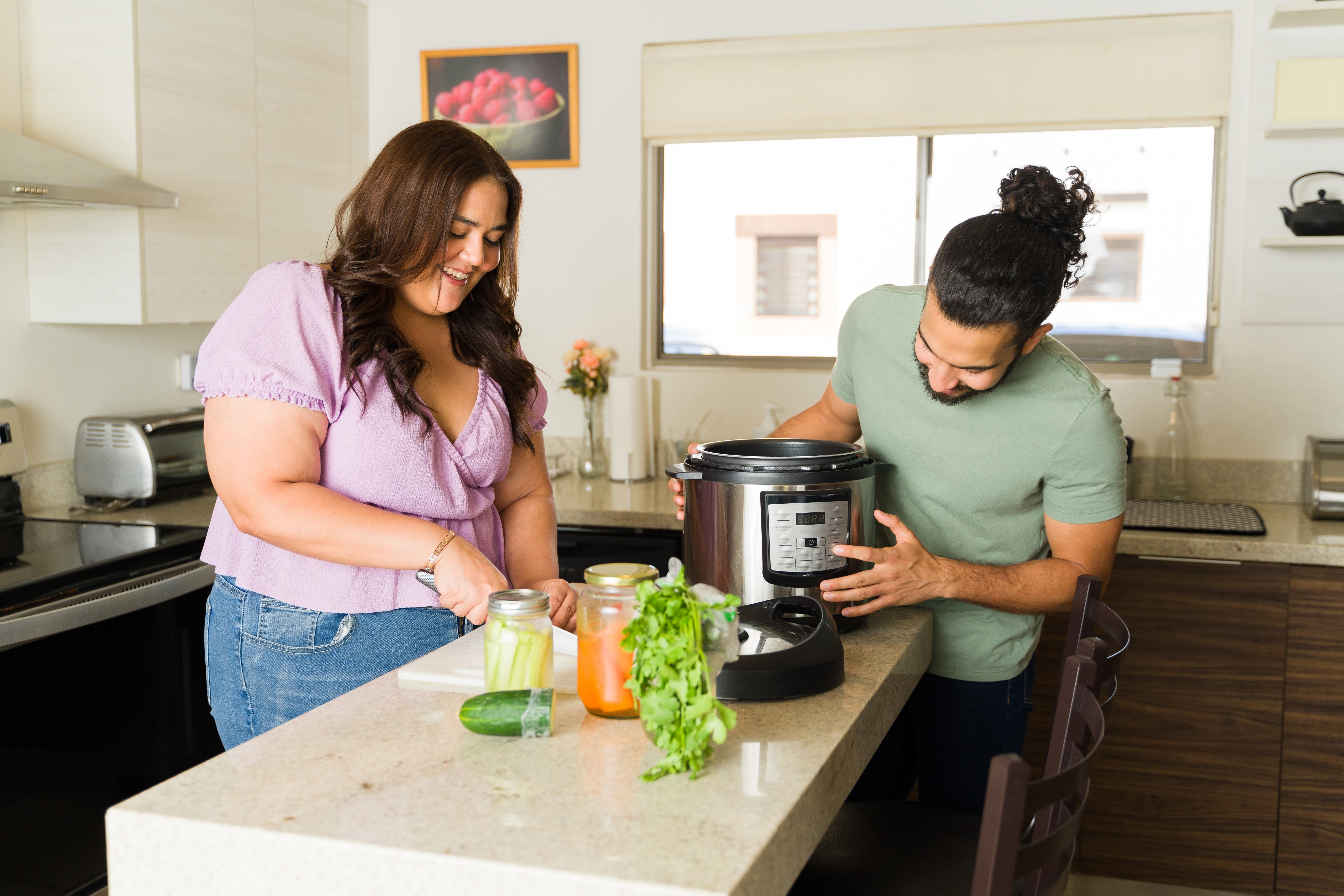 A man and woman cooking with a slow cooker