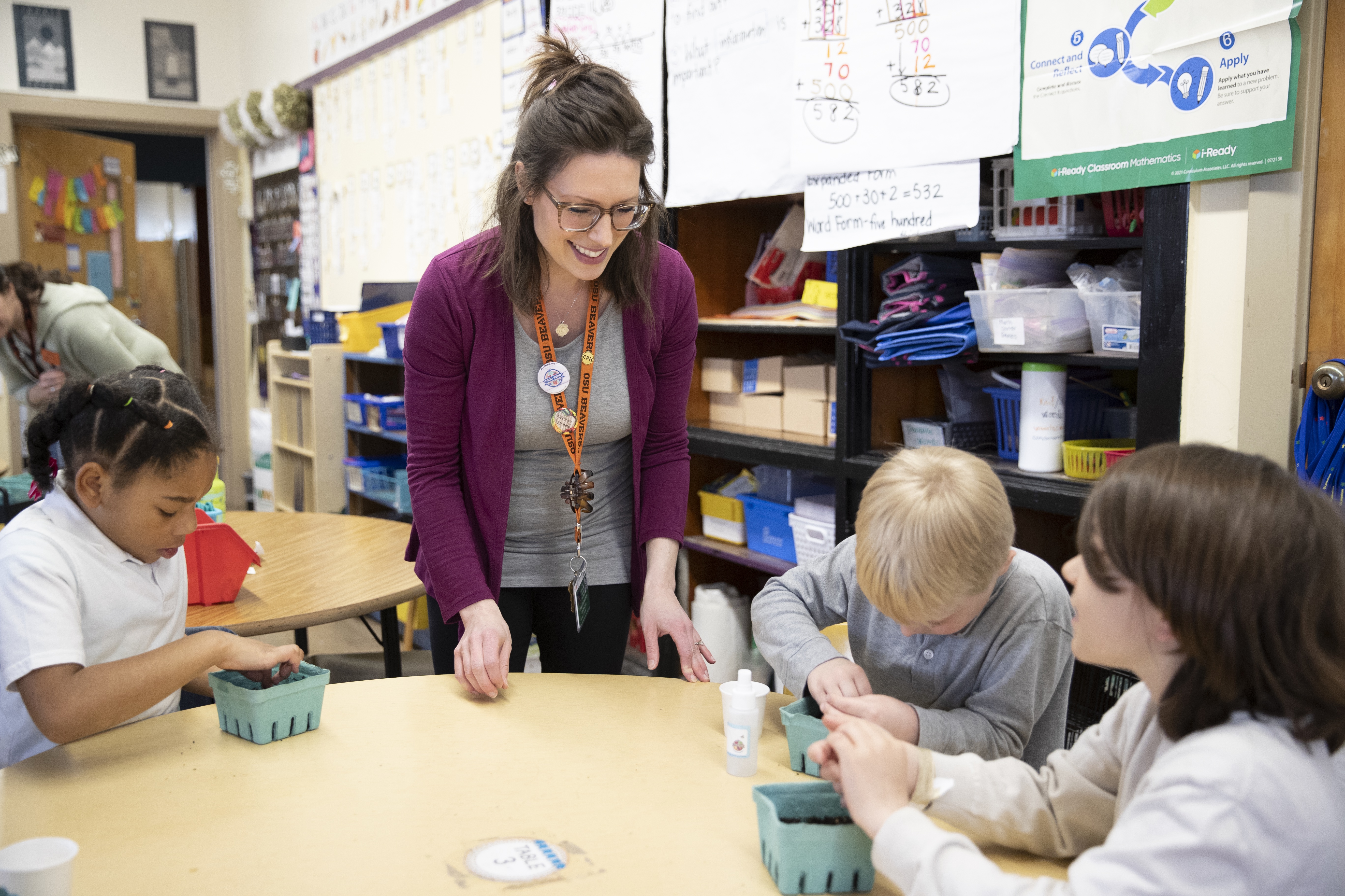Nutrition educator teaching students at local Oregon Elementary School about gardening and nutrition 