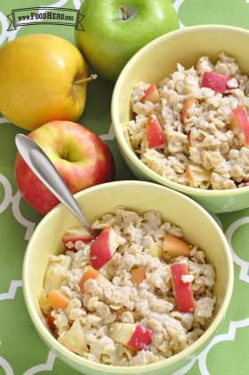 Homemade oatmeal with chopped apple and warm spices are shown in bowls.