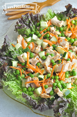 Tuna and pea mix served over a bed of lettuce.