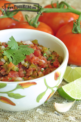 Medium bowl of diced tomato salsa with cilantro. 