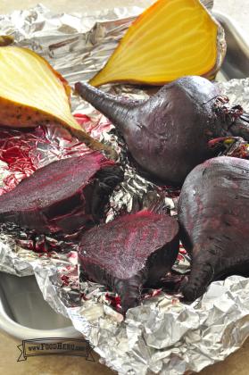Baking sheet with golden and red beets. 