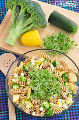 Big bowl of spiral pasta with vegetables.