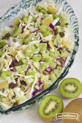 Mix of kiwi with vegetables in a large bowl. 