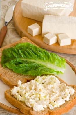 Creamy tofu mix served on bread with lettuce.