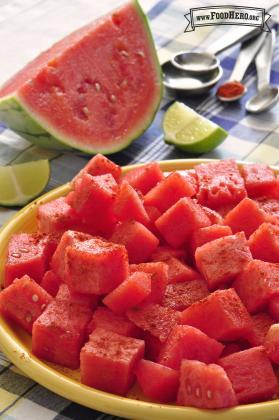 Plate of seasoned watermelon chunks. 