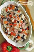 Large dish of a simple rice, sausage and vegetable mix.