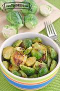 Bowl of seasoned and browned brussels sprout halves.