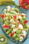 Colorful mix of chopped fruit with dressing.