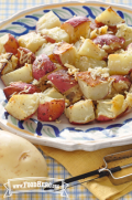 Plate of red potatoes with grated parmesan cheese.