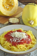 Spaghetti squash strands served with red sauce and grated parmesan cheese.