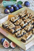 Oat bars with a gooey fig center on a serving platter.