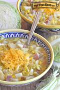 Small bowls of potato and ham soup with shredded cheese.