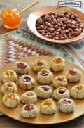 Plate of bite-sized cookies with a gooey jam center. 