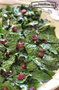 Plate of stir-fried kale with cranberries.