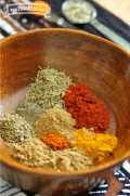 Wooden bowl with ground spices.