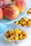 Small bowls of yogurt with a soft peach topping.