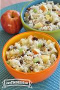Bowls of rice with celery, apples and raisins.