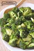 Bowl of tender broccoli sprinkled with sesame seeds. 