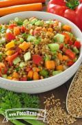 Bowl of wheat berries with a colorful vegetable mix.