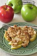 Plate of baked sliced apples with a sweet granola topping.