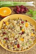 Large bowl of a colorful mix of bulgur, fruit and vegetables.