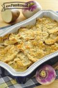 Baking dish of potatoes and turnips with a crispy top layer of breadcrumbs.