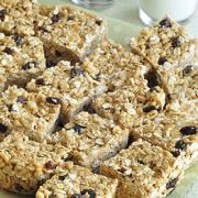 Platter of oat and peanut butter squares with raisins.