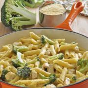 Creamy pasta and broccoli in a skillet.