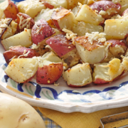 Plate of red potatoes with grated parmesan cheese.