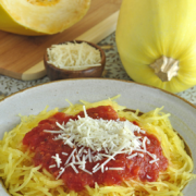 Spaghetti squash strands served with red sauce and grated parmesan cheese.