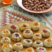 Plate of bite-sized cookies with a gooey jam center. 