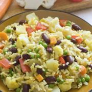 Plate of rice and bean mix with vegetables. 