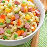 Macaroni noodles with ham, vegetables and dressing.