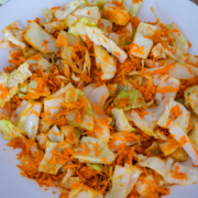 Plate of cabbage mixed with shredded carrots.