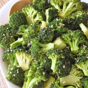 Bowl of tender broccoli sprinkled with sesame seeds. 