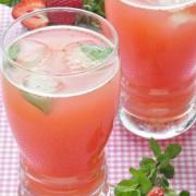 Glasses of pink strawberry water with mint.