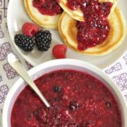 Display of Any Berry Sauce recipe served over pancakes