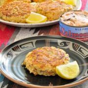 Plate of golden Salmon Patties with lemon slices. 