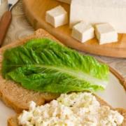 Creamy tofu mix served on bread with lettuce.