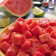 Plate of seasoned watermelon chunks. 