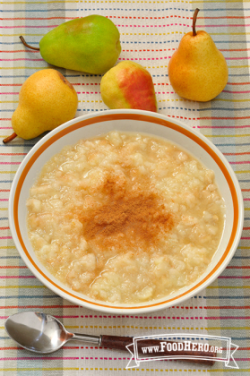 Bowl of chunky textured mashed pears topped with spices.