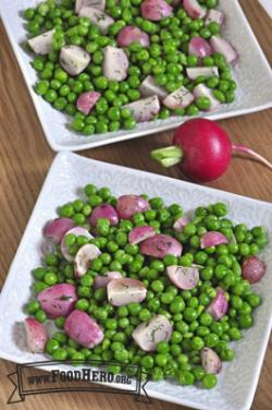 Plates of a vibrant pea and radish mix.