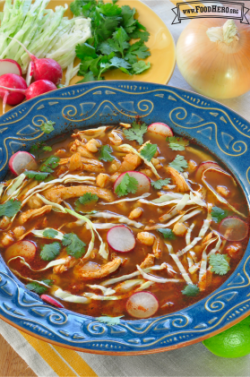 Large bowl of pozole soup sprinkled with cilantro. 