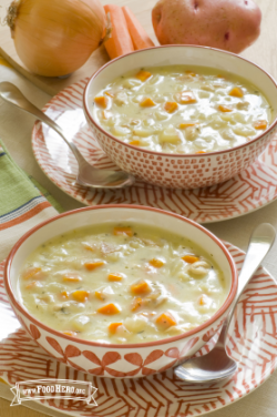 Bowls of creamy potato chicken soup on serving plates.