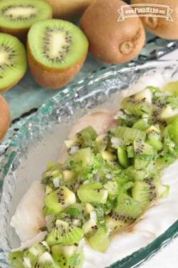 Platter of chopped kiwi with dressing.